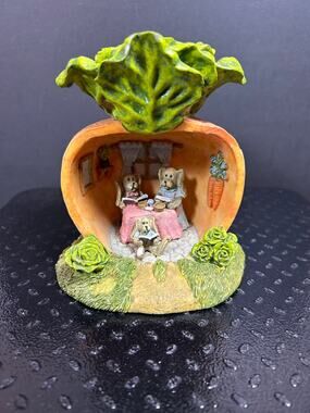vintage CBK resin figurine with a family of rabbits inside a hollowed carrot.